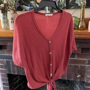 Caution to the Wind burnt-orange top! Size medium. Little snag (see last photo)